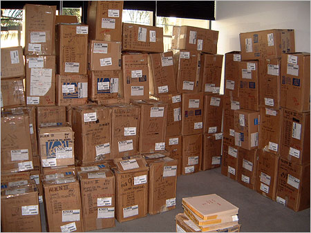 Boxes of film that have been pulled from storage to be cataloged for the Quadrilogy production.