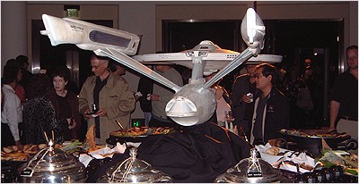 The Enterprise. You might notice Star Trek production artist Michael Okuda standing underneath the model.