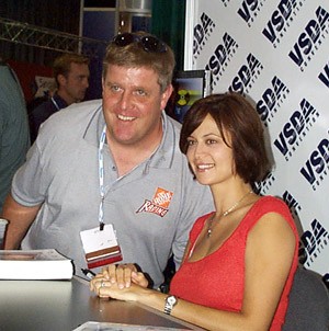 Catherine Bell from TV's JAG poses for a photo with a fan.